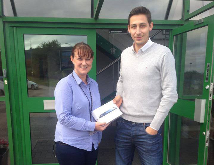 Sean Martin of Projx Services presenting Jo Porter of Hazeldene Foods with her Apple iPad prize.